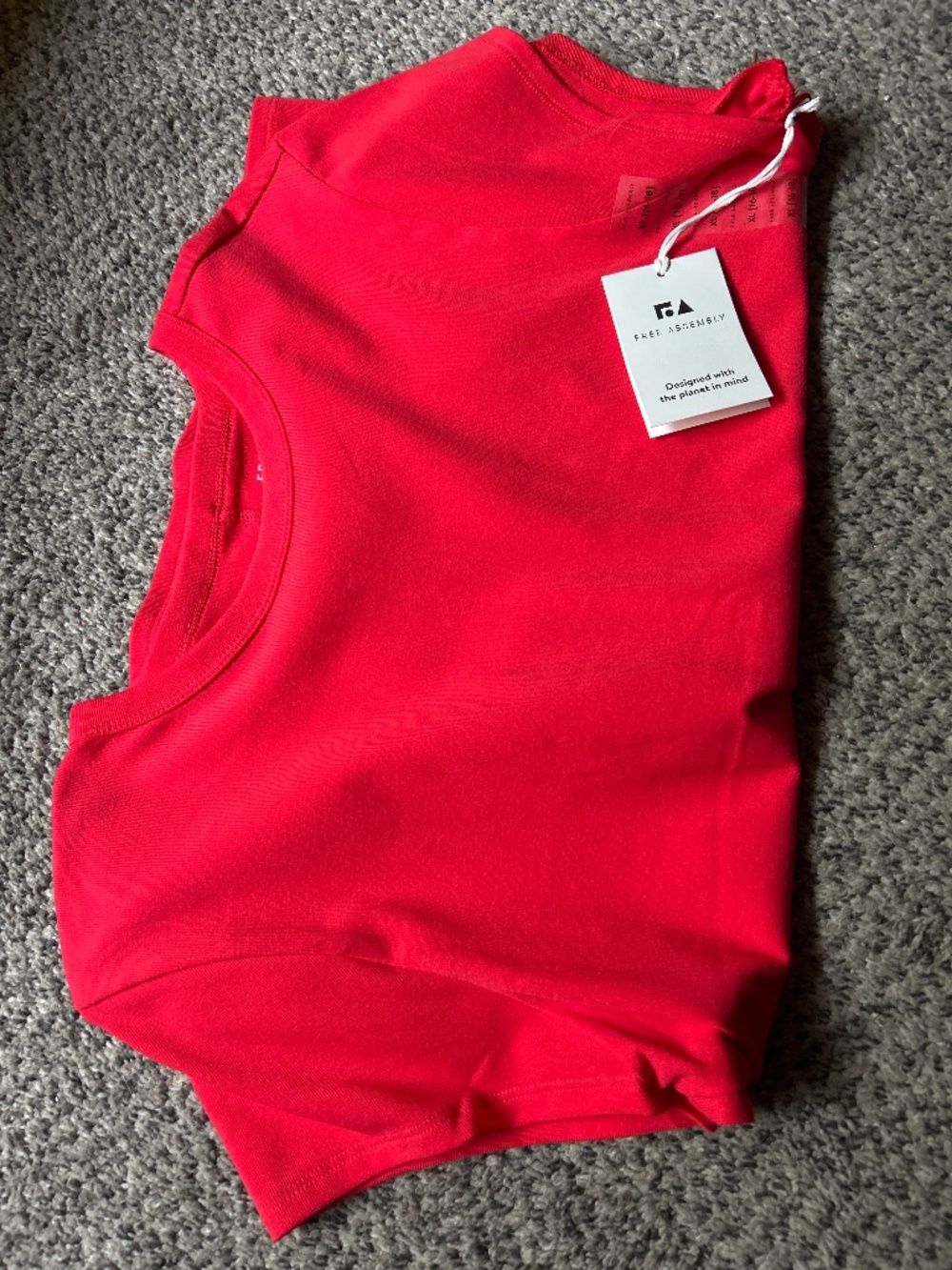 Free assembly coral colored T-shirt, extra large